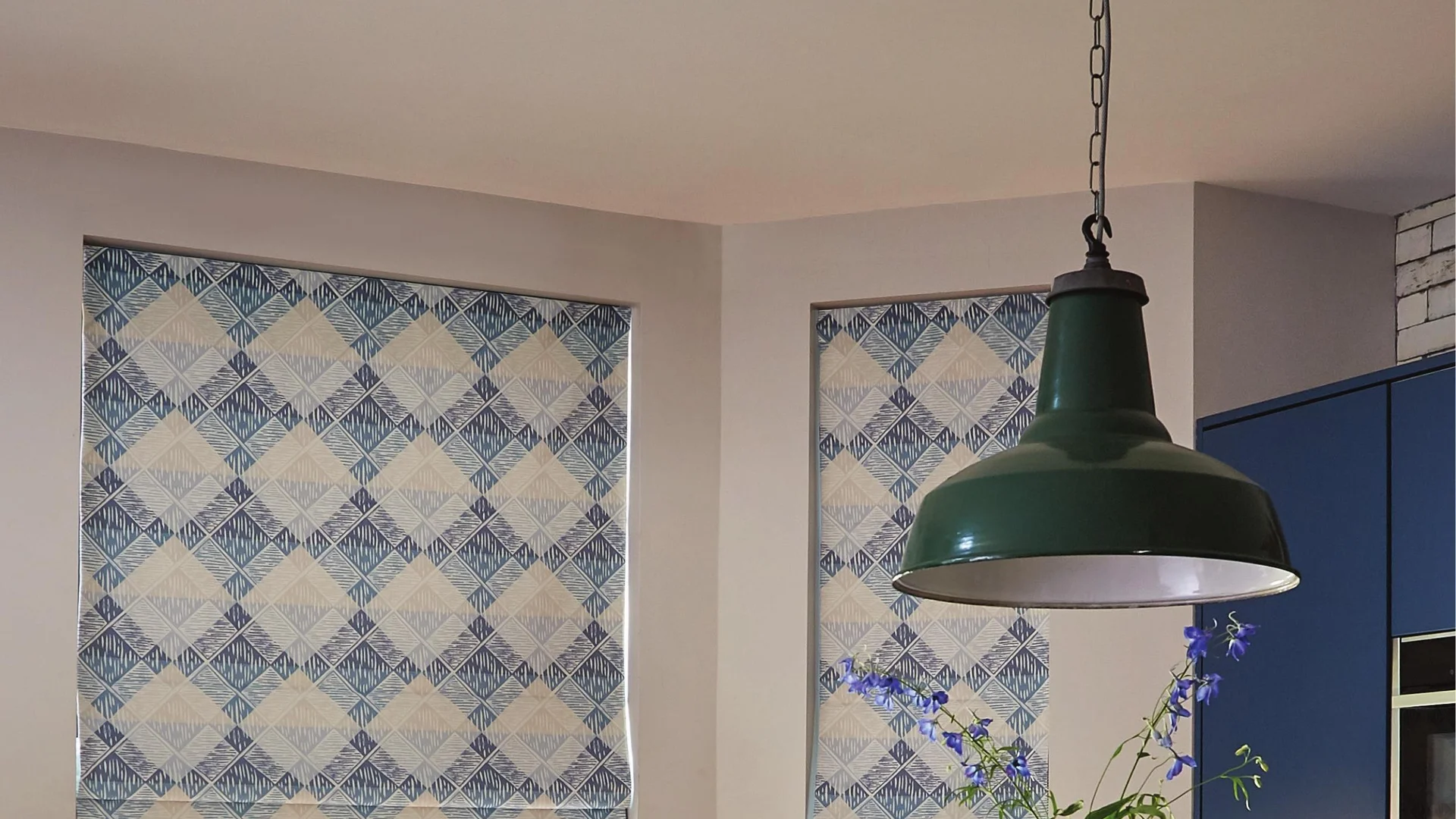 Patterned Roman blinds in a kitchen