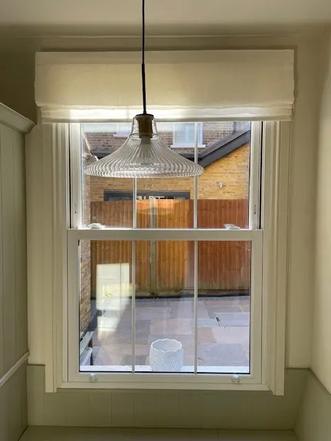 A linen blind suited to a home office